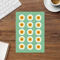 Poppy sticker sheet on a tidy desk with a notebook and coffee, illustrated by Tucson-based artist Nicole Peery